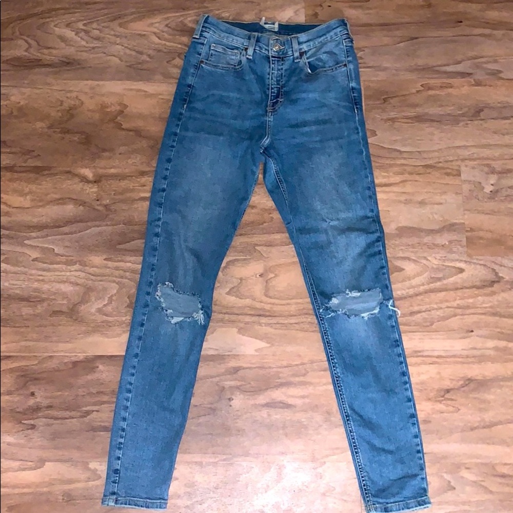 Top shop blue jeans with holes at the knee